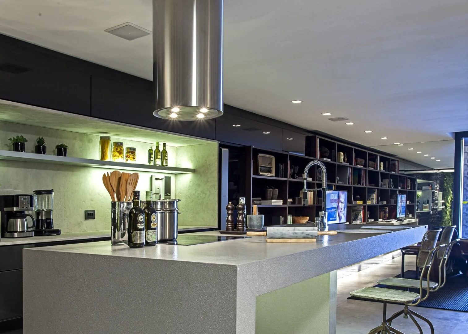 Contemporary kitchen with a grey waterfall island and streamlined cabinetry