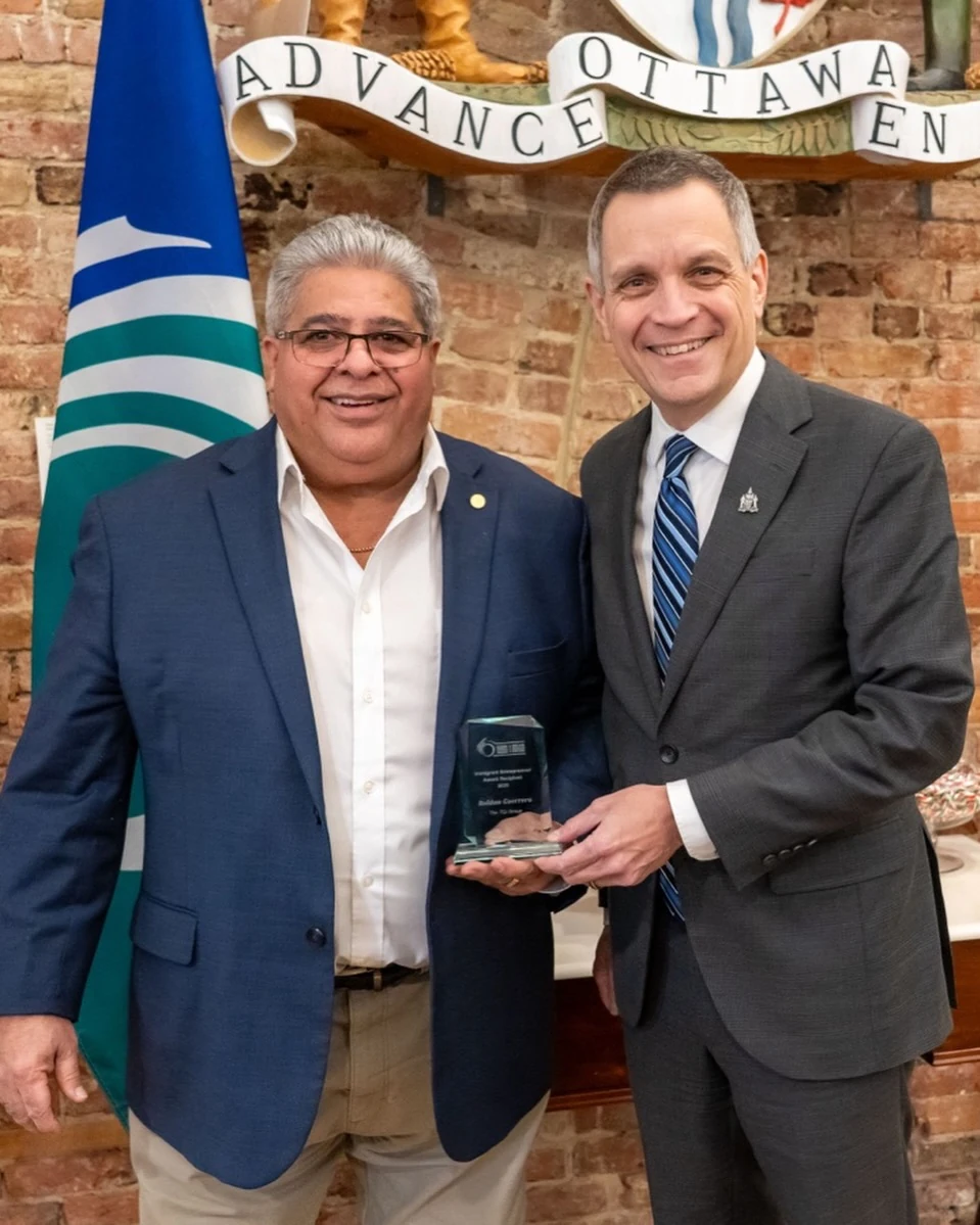 Roldan Guerrero with Ottawa Mayor Mark Sutcliffe and his 2025 entrepreneur award