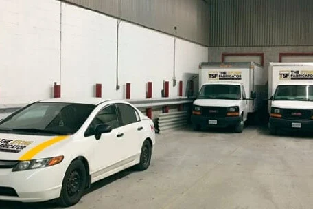 The indoor TSF loading area with delivery vehicles.