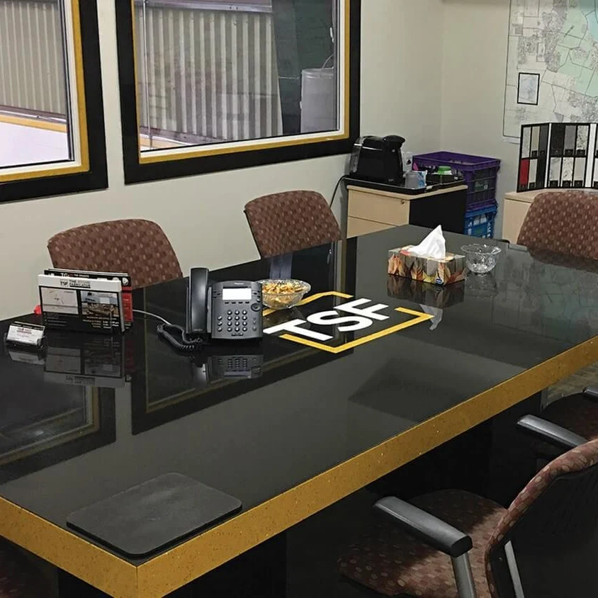 TSF boardroom with a stone meeting table.